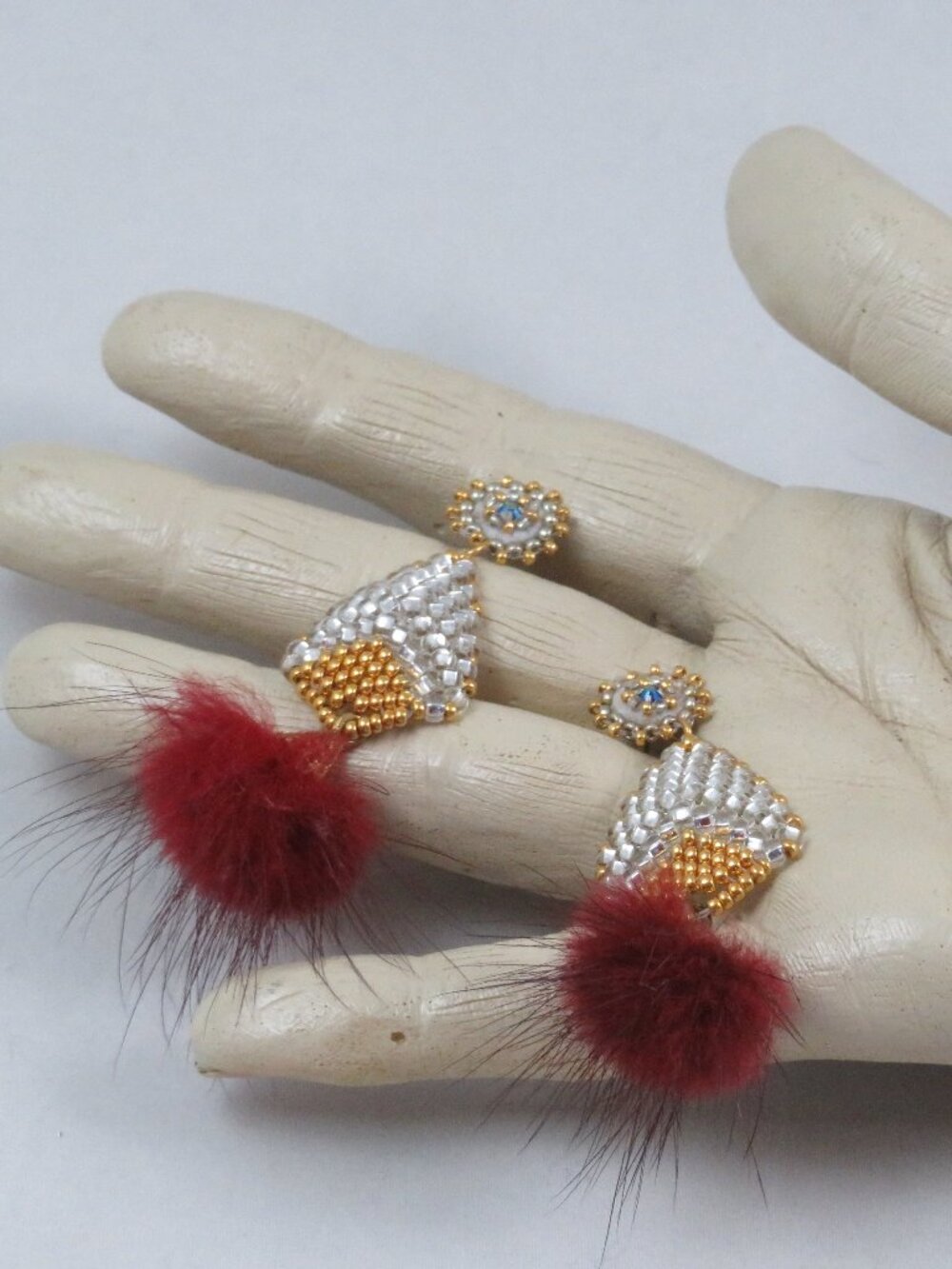 Silvery white and gold fur puff earrings